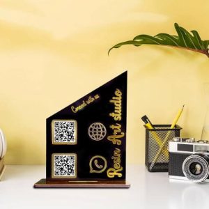 Crystal clear acrylic qr code stand on a white desk displaying custom GPay and Instagram codes.