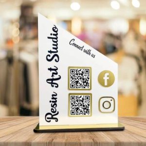 acrylic desk display with custom printed Facebook and Instagram QR codes.