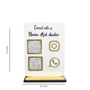 A minimalist white social media qr code stand placed on a marble reception desk in a beauty salon, displaying a "Follow Us" Instagram code.