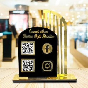 A bold qr code stand with a dark background on a wooden counter displaying custom payment codes.