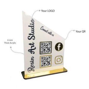 A white payment stand with a Google Pay and WhatsApp Business QR code.