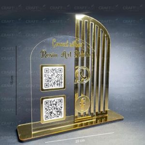 A dual-slot qr code scanner stand showing both Google Pay and Paytm codes for easy checkout.