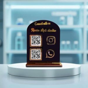 Close up of a gold acrylic stand acting as a gpay qr code stand for easy digital payments.