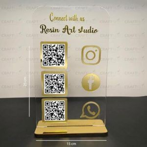 Gold mirror desk sign with an Instagram logo and qr code asking customers to follow.