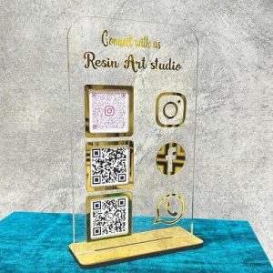 qr code stand on a jewelry counter displaying GPay and Instagram codes.