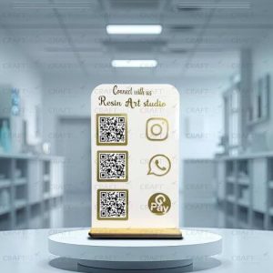 Rose gold mirror acrylic qr code stand on a white marble salon counter displaying Instagram and GPay codes.