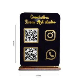 A personalized acrylic qr code scanner stand placed on a wooden retail shop counter next to a point-of-sale system.