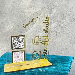 A transparent payment stand with bold black printed Google Pay and Barcode Scanner codes.