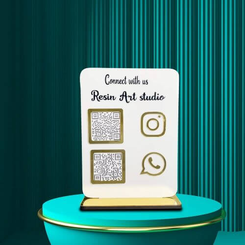 Scan to Chat WhatsApp QR Stand A customer scanning a WhatsApp QR code on a white acrylic stand at a reception counter.